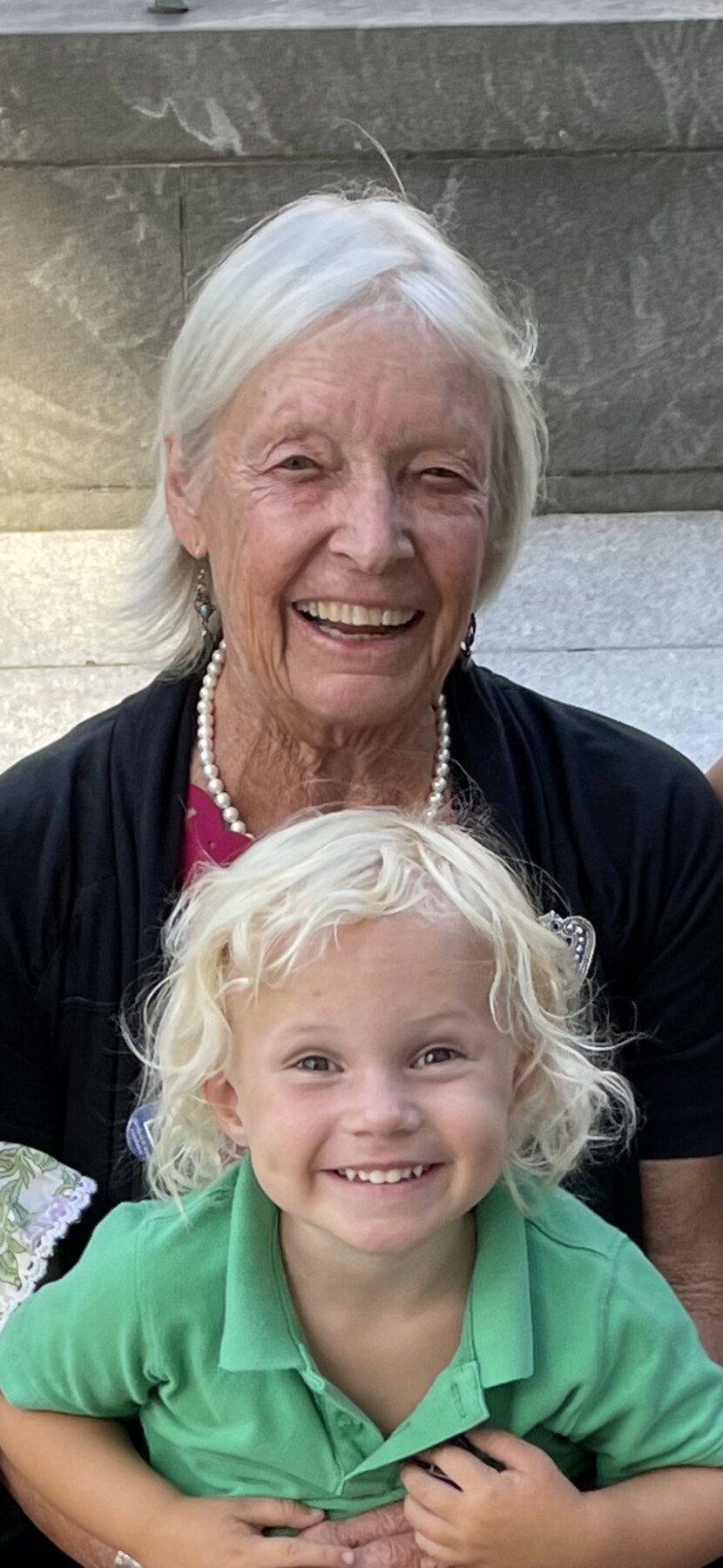 Sally smiling with her grandchild